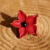 fleur étoilée rouge, cuir végétal, l'âge du cuir, maroquinerie artisanale, dordogne, france