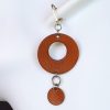 boucles d'oreilles pendantes rond marron , tannage végétal, l'âge du cuir, maroquinerie artisanale éthique et responsable, dordogne, france