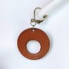 boucles d'oreilles rond marron , tannage végétal, l'âge du cuir, maroquinerie artisanale éthique et responsable, dordogne, france