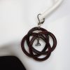boucle d oreille noeud triskel aubergine, l'âge du cuir, maroquinerie artisanale éthique et responsable, dordogne, france